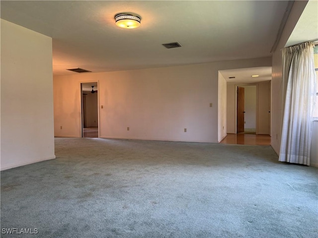 empty room featuring light colored carpet