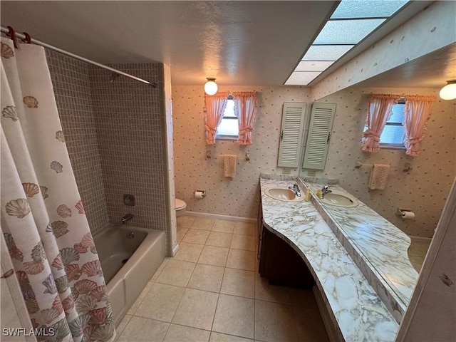 full bathroom featuring vanity, tile patterned floors, toilet, and shower / bath combo with shower curtain