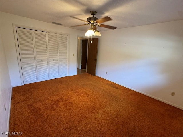 unfurnished bedroom featuring ceiling fan, carpet floors, and a closet