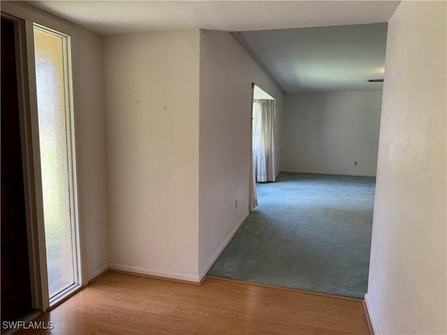 spare room featuring light hardwood / wood-style floors