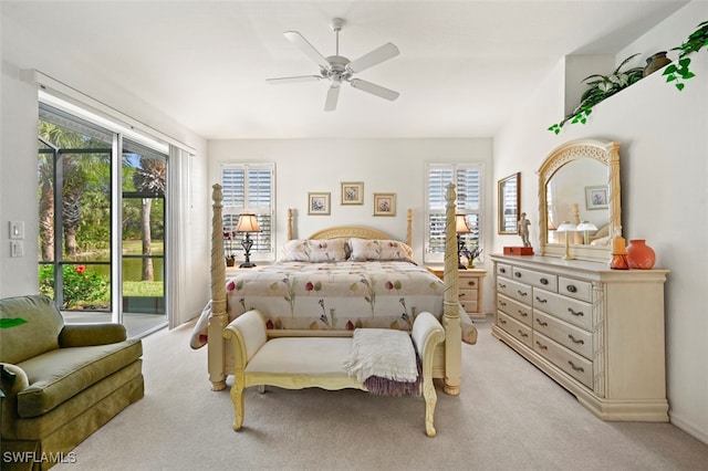 carpeted bedroom featuring access to exterior and ceiling fan