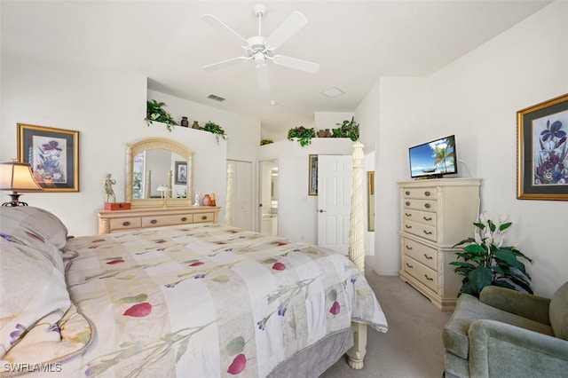 bedroom featuring carpet flooring, ensuite bathroom, and ceiling fan