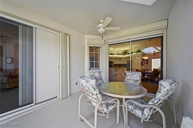 sunroom / solarium featuring ceiling fan