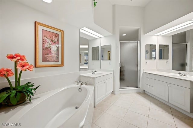 bathroom with tile patterned flooring, vanity, and plus walk in shower