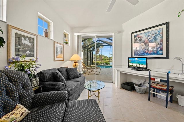 living room featuring ceiling fan and light tile patterned flooring