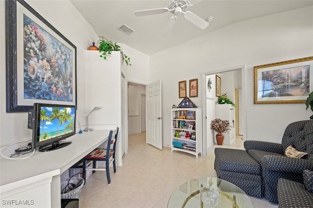 home office featuring light tile patterned floors, ceiling fan, and lofted ceiling