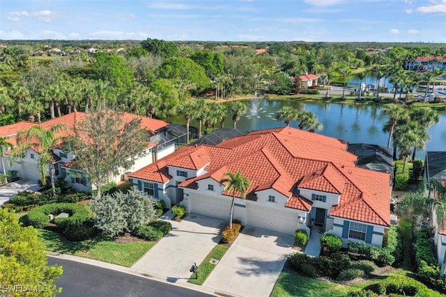 birds eye view of property with a water view