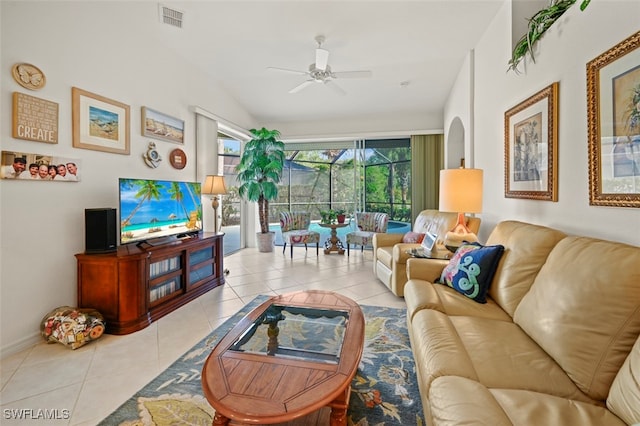 living room featuring ceiling fan and light tile patterned floors