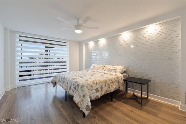 bedroom featuring ceiling fan and hardwood / wood-style flooring