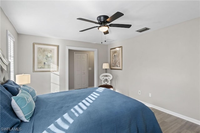 bedroom featuring wood-type flooring and ceiling fan