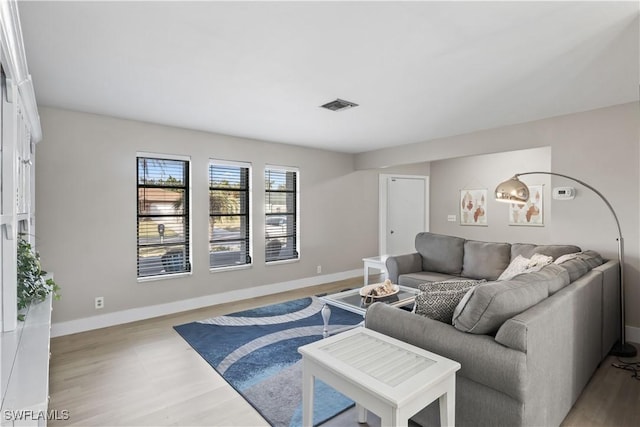 living room with light hardwood / wood-style flooring