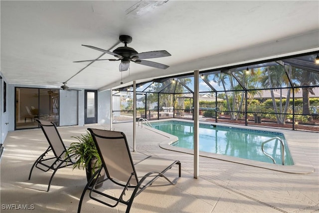 view of pool with a patio, ceiling fan, and a lanai