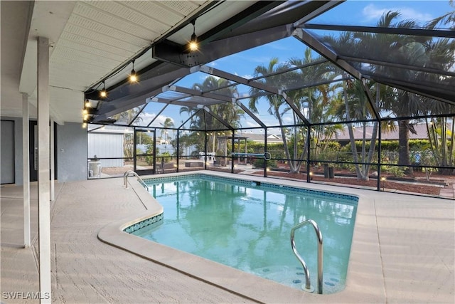 view of pool featuring a lanai and a patio