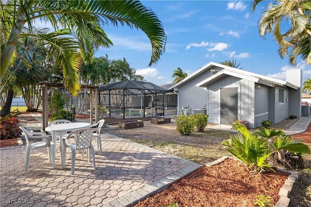 exterior space with a pool and a lanai