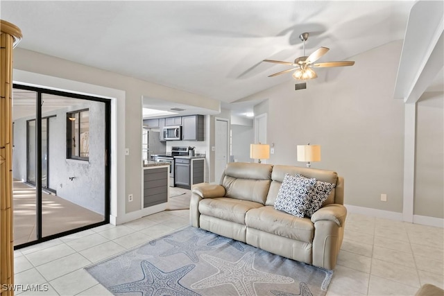 tiled living room featuring ceiling fan