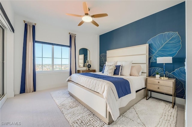 carpeted bedroom featuring ceiling fan