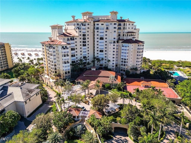 birds eye view of property featuring a water view and a view of the beach