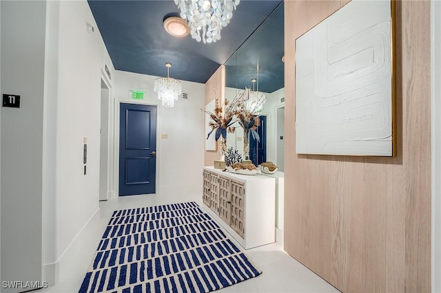 entryway with a notable chandelier