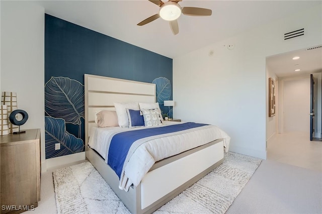 carpeted bedroom featuring ceiling fan