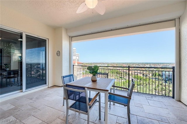 balcony featuring ceiling fan