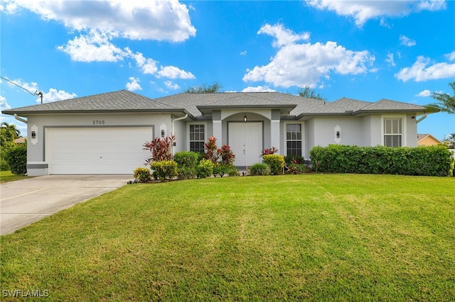 ranch-style home with a garage and a front lawn