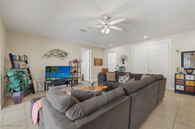 tiled living room featuring ceiling fan