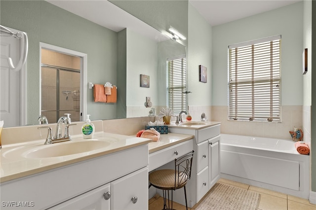 bathroom featuring tile patterned flooring, vanity, separate shower and tub, and a healthy amount of sunlight