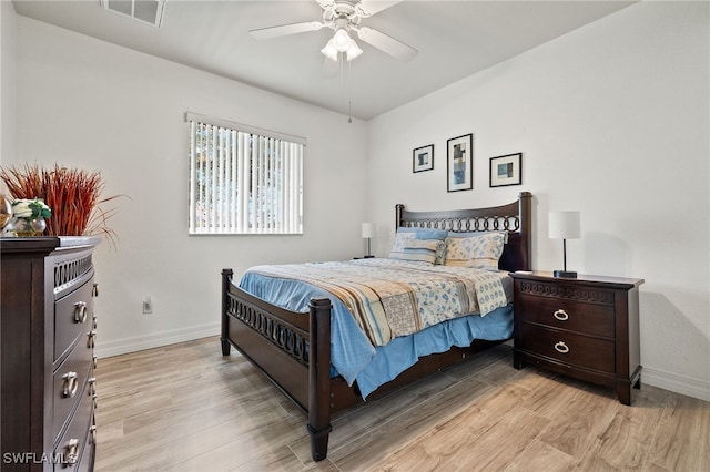 bedroom with light hardwood / wood-style flooring and ceiling fan