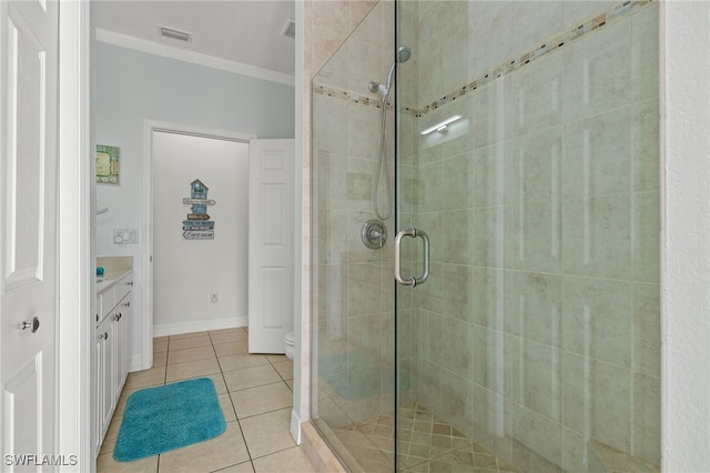 bathroom featuring tile patterned floors, an enclosed shower, ornamental molding, vanity, and toilet