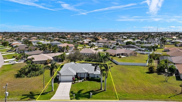 birds eye view of property with a residential view