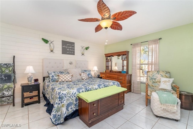 bedroom with ceiling fan and light tile patterned floors