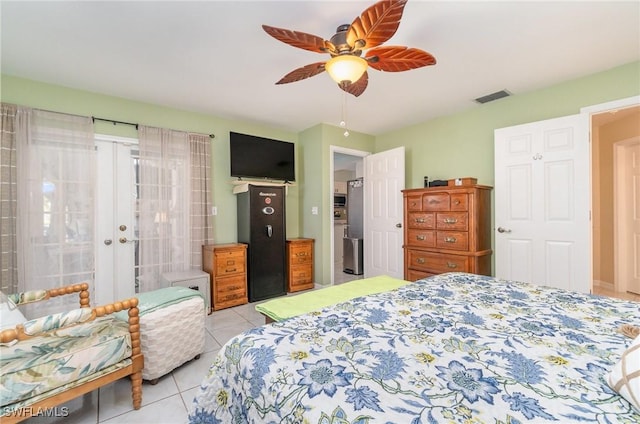 bedroom featuring ceiling fan and light tile patterned floors