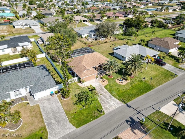 birds eye view of property with a residential view