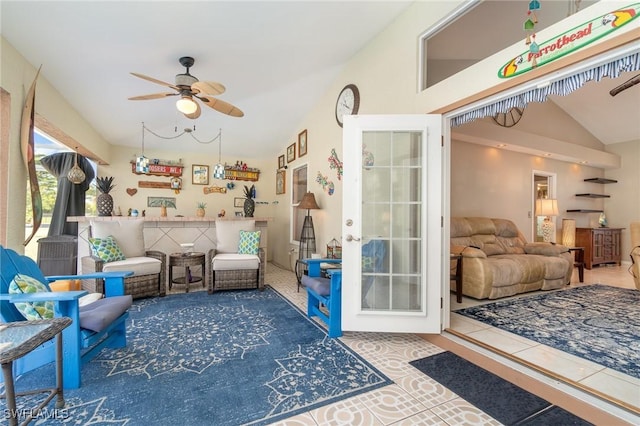 living area with lofted ceiling and ceiling fan