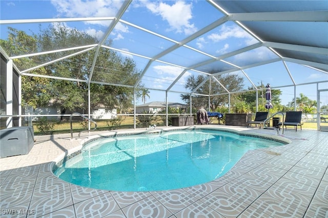 view of pool with a lanai and a patio area