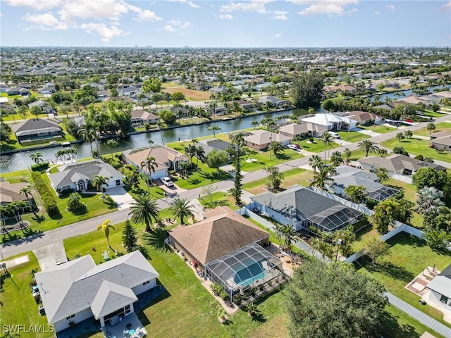 bird's eye view featuring a water view and a residential view