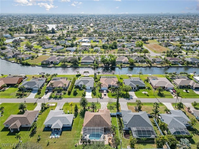 bird's eye view with a water view and a residential view