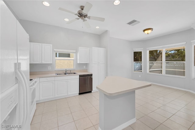 kitchen featuring white appliances, ceiling fan, sink, light tile patterned floors, and white cabinetry