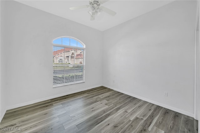 empty room featuring ceiling fan and light hardwood / wood-style floors