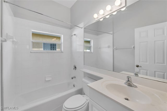 full bathroom featuring vanity, toilet, and tiled shower / bath