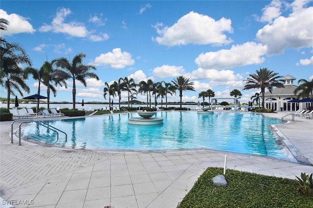 view of swimming pool with a patio area