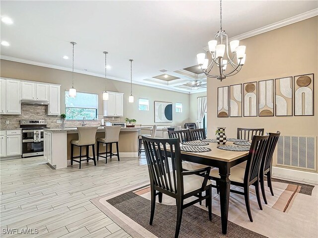 dining room featuring beam ceiling, coffered ceiling, light hardwood / wood-style flooring, ceiling fan with notable chandelier, and ornamental molding