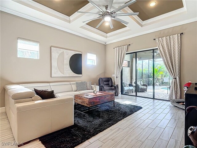 living room with ornamental molding, beam ceiling, coffered ceiling, and a healthy amount of sunlight