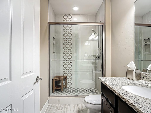 20462 Misty Woods Ct, Estero, FL 33928 - full bath with toilet, vanity, a stall shower, and recessed lighting
