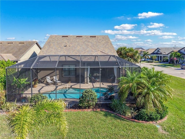 20462 Misty Woods Ct, Estero, FL 33928 - rear view of house with a lanai, a yard, an outdoor pool, and a patio area