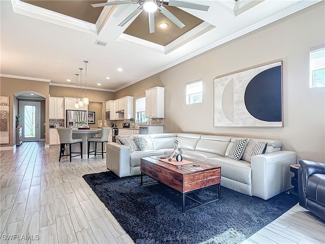 20462 Misty Woods Ct, Estero, FL 33928 - living area with healthy amount of natural light, crown molding, ceiling fan, coffered ceiling, and arched walkways