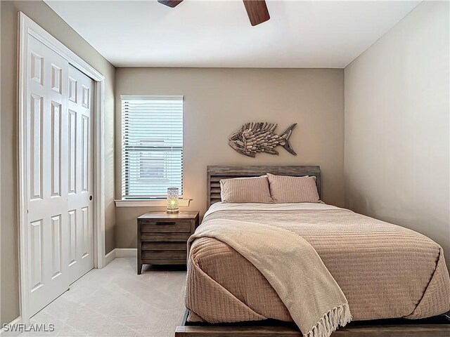 20462 Misty Woods Ct, Estero, FL 33928 - bedroom featuring light carpet, baseboards, a ceiling fan, and a closet