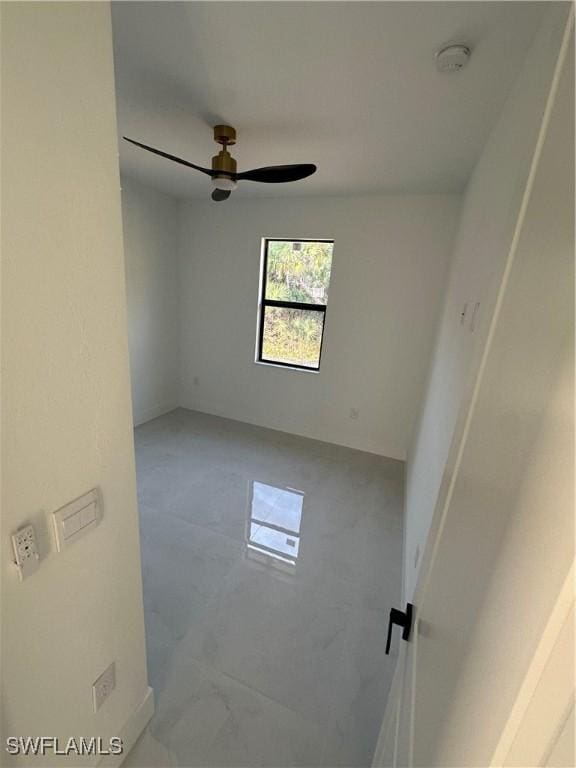 spare room with ceiling fan