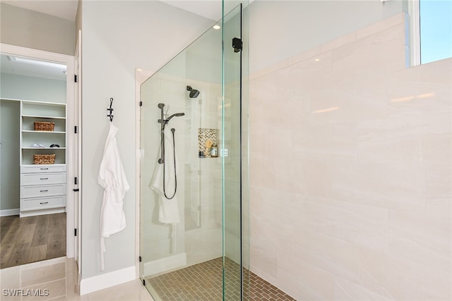 bathroom with a tile shower