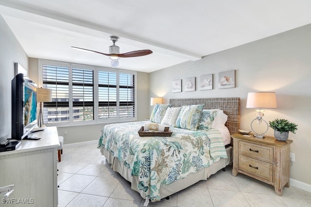 tiled bedroom featuring ceiling fan